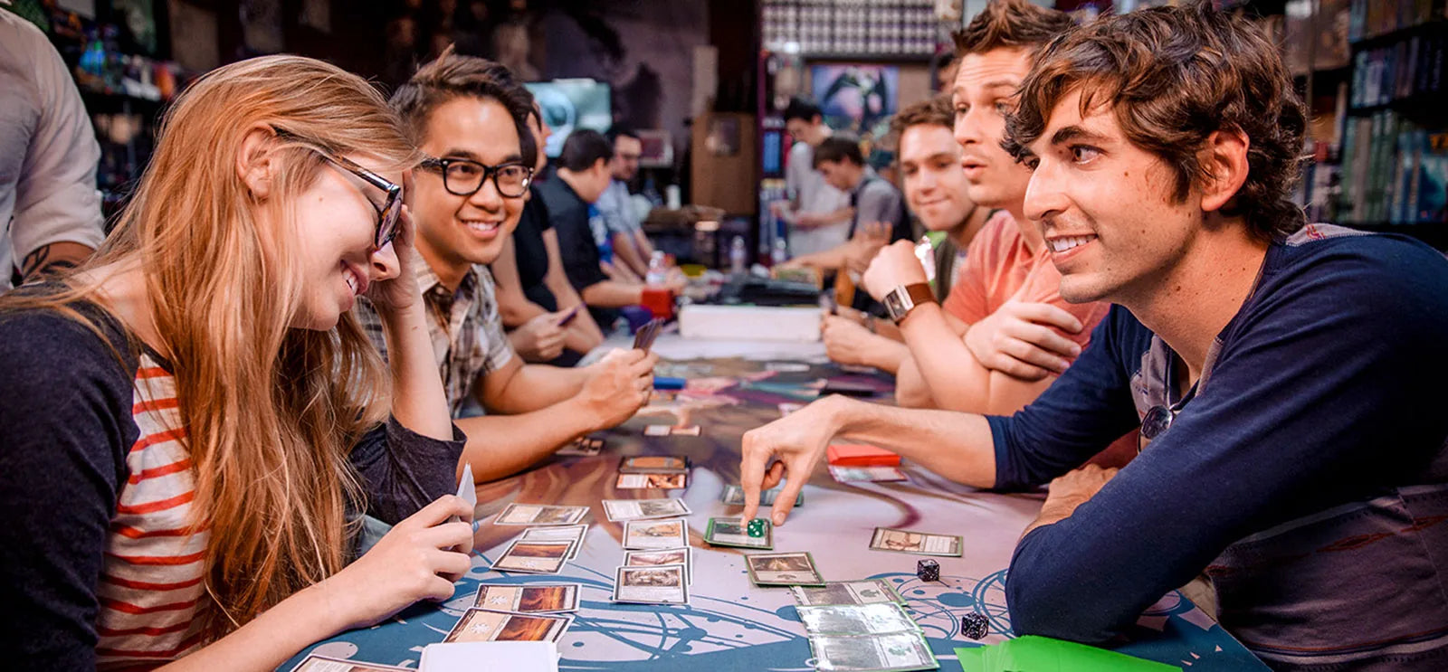 Magic: The Gathering cards, lands and dice on a playmat